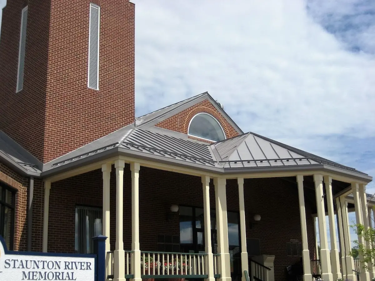 Skilled roofing craftsmen working on a residential roof in Price